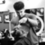 Barber cutting kids hair