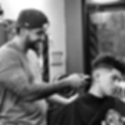 Barber cutting kids hair