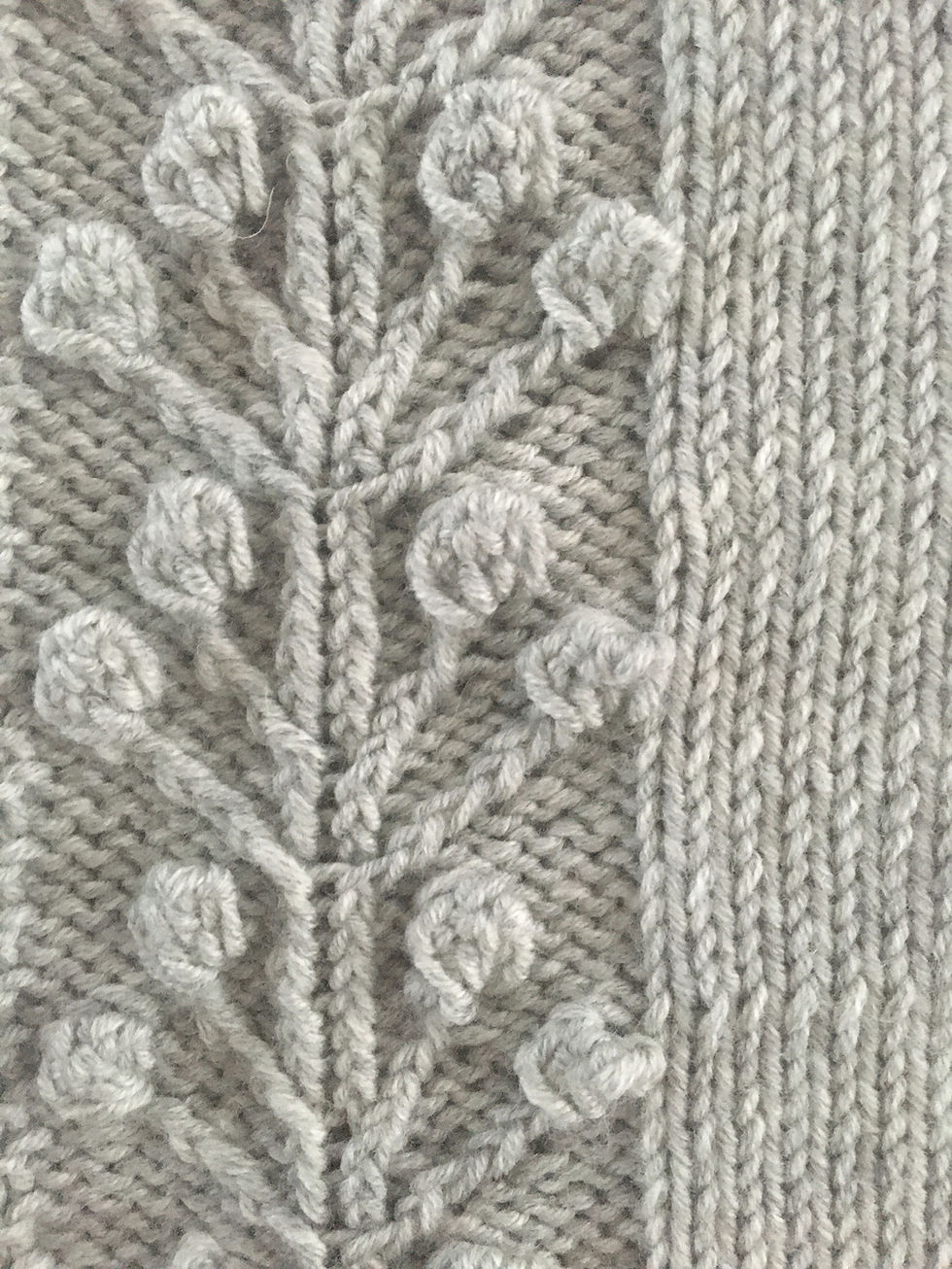 Thumbnail: Knitted baby cardigan in grey with winter berry cable detail by Little Fig