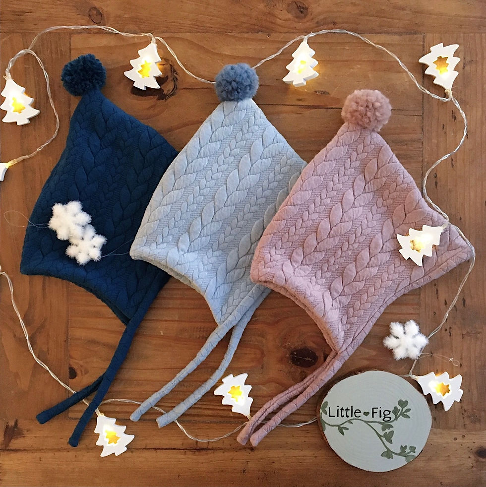 Oakley jersey cable knit pixie bonnet in petrol, light blue and pink by Little Fig