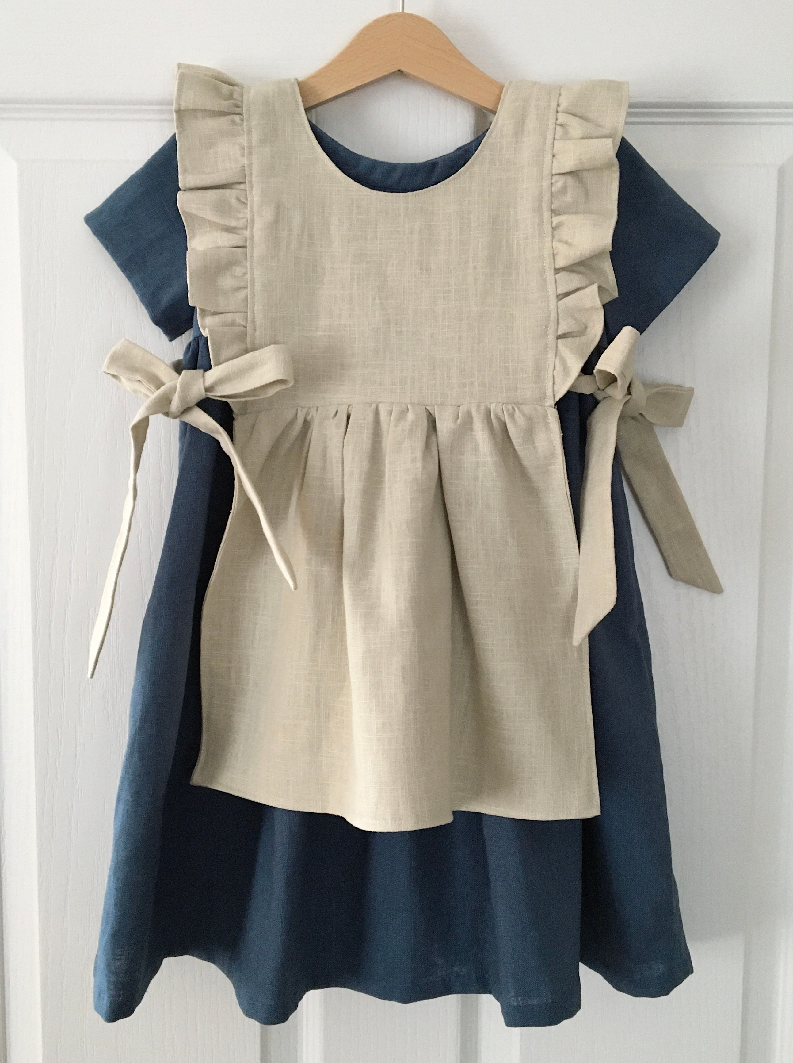 Daisy navy linen children's dress by Little fig with apron by Little Fig
