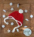 Handmade crocheted red and white christmas bobble ear flap hat by Little Fig