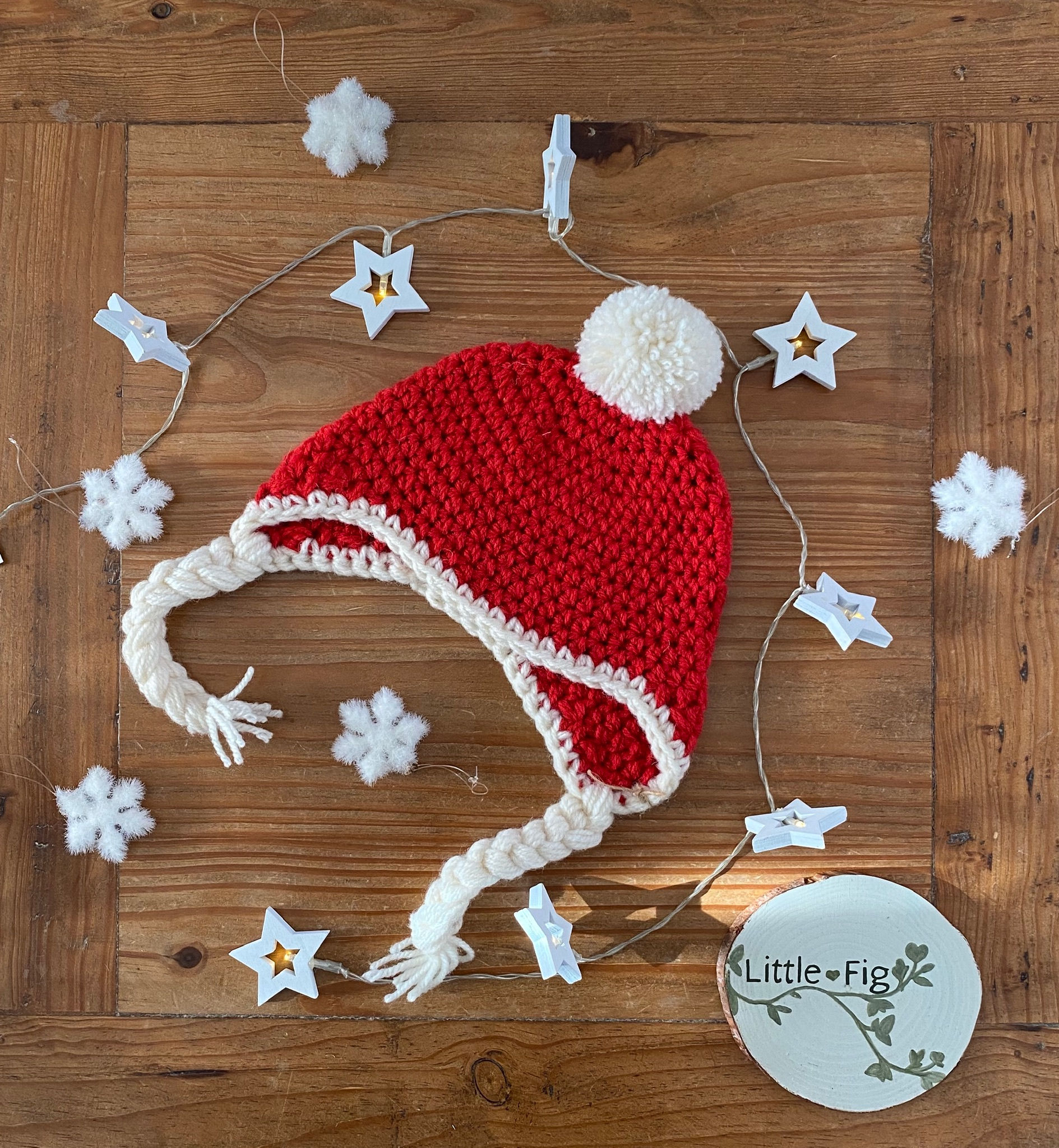 Handmade crocheted red and white christmas bobble ear flap hat by Little Fig