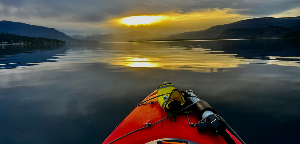 Kayak with sunset on mountain lake showing relaxing fighting depression and anxiety