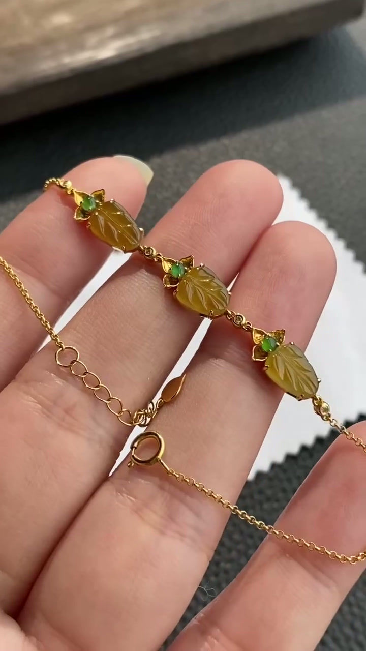 Hình thu nhỏ: Lắc tay lá ngọc Jadeite A vàng 18K