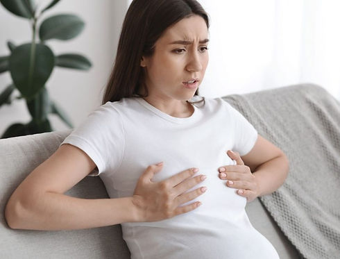 Engorgement-woman-holding-breast-1260x630_edited.jpg