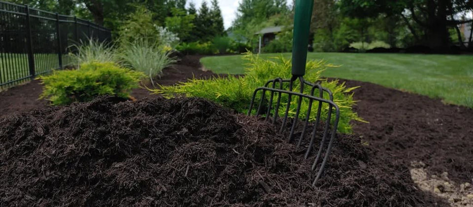 A pile of fresh mulch being installed.