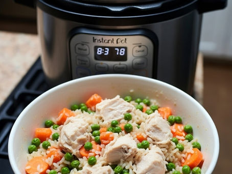 Chicken, rice, carrots, and peas in a large bowl