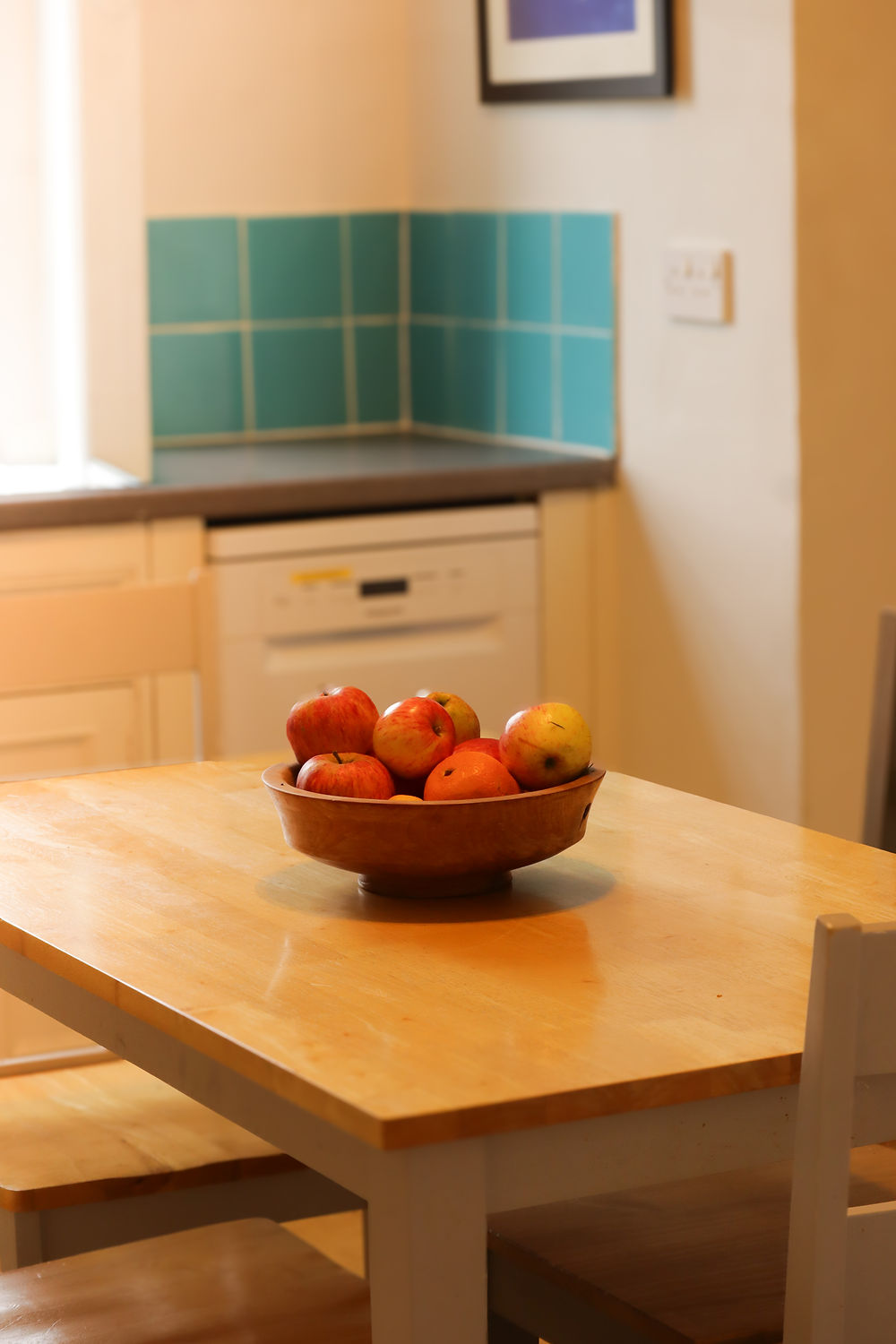 Dining room table with a bowl of fruits