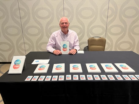 Signing books, chatting with friends at ADARA conference