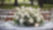 white floral arrangement on a table outside for a funeral, landscape .jpg
