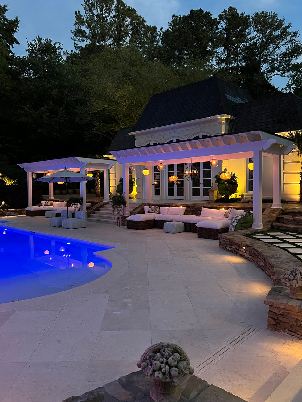 a large house with a swimming pool in front of it
