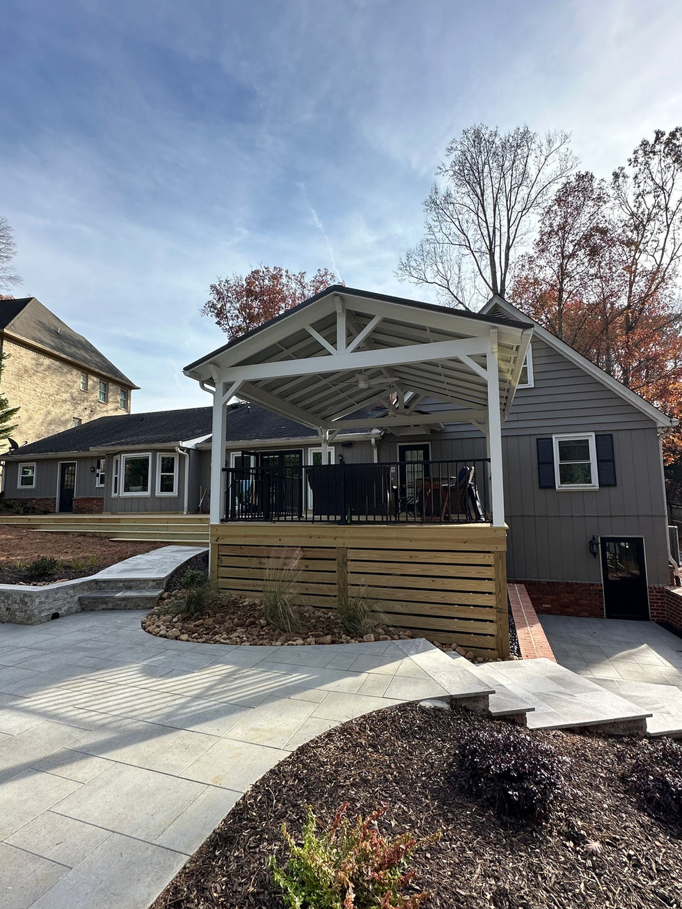 the back of a house with a covered deck