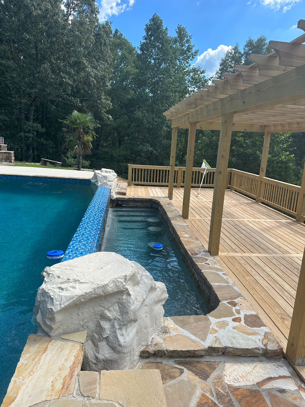 a swimming pool with a wooden deck underneath it