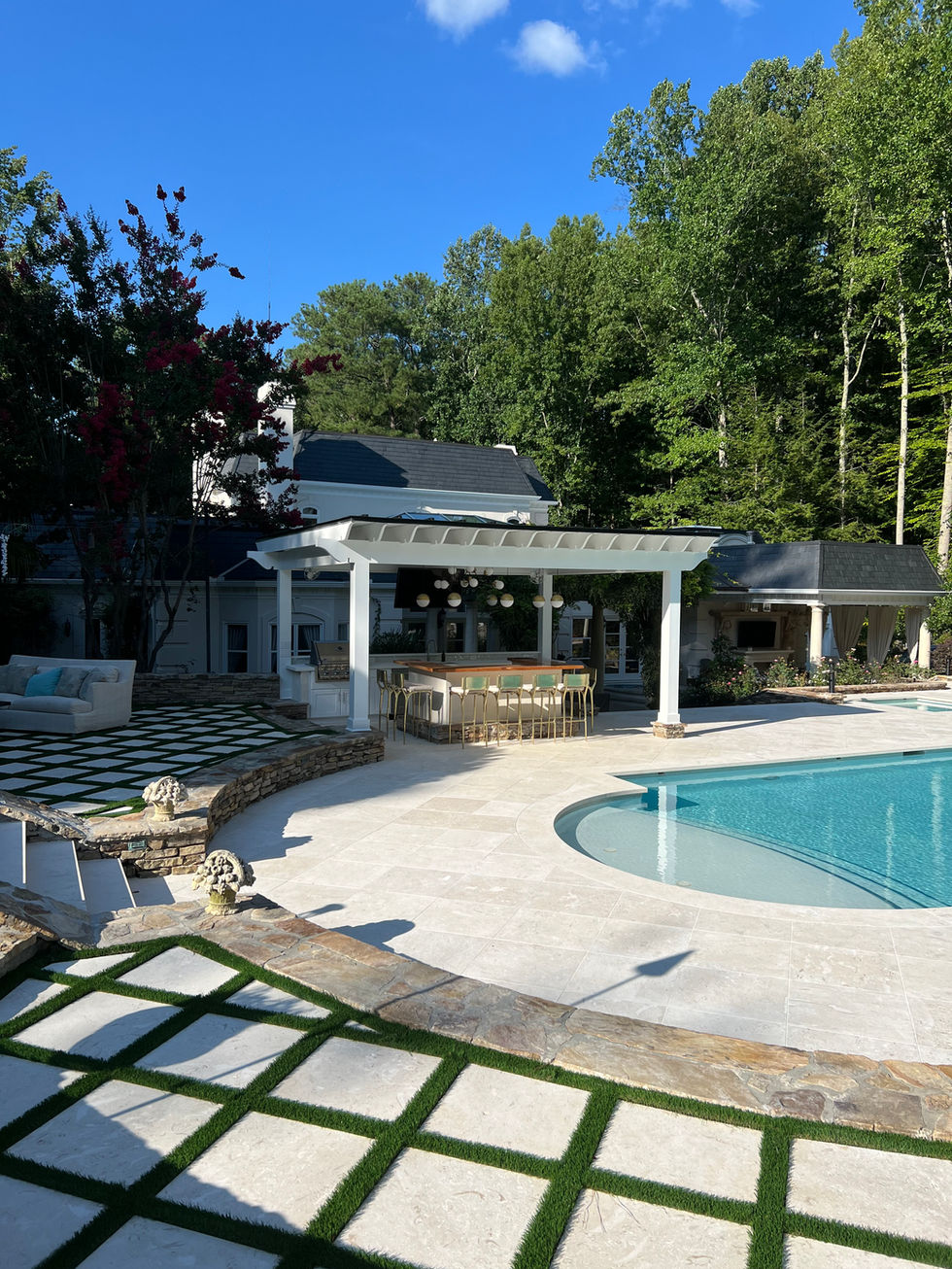 a large swimming pool with a white pergola over it