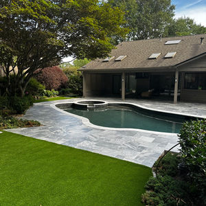 a house with a large swimming pool in the backyard