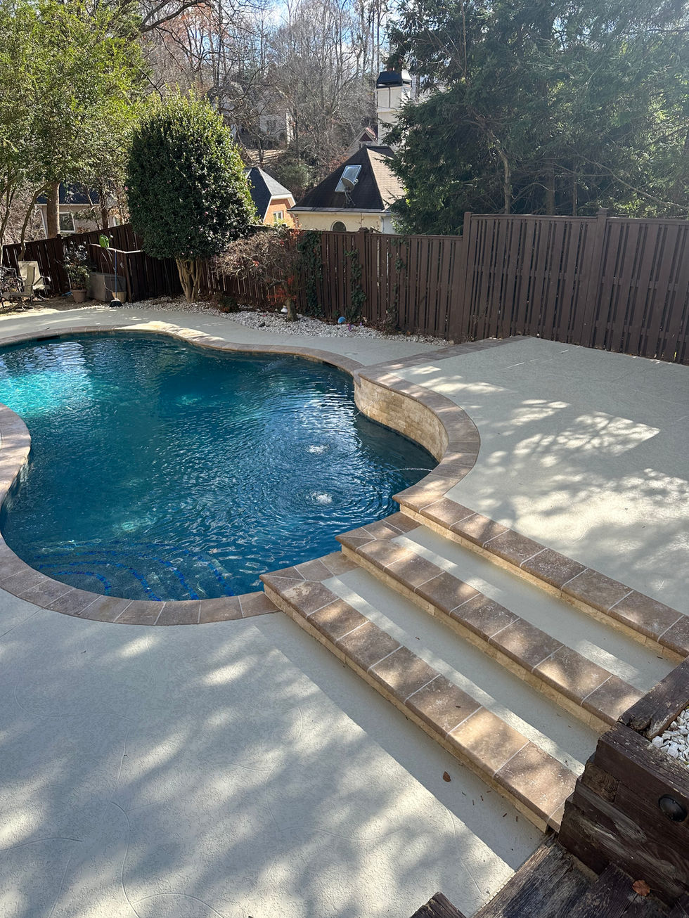 a large swimming pool with stairs leading to it