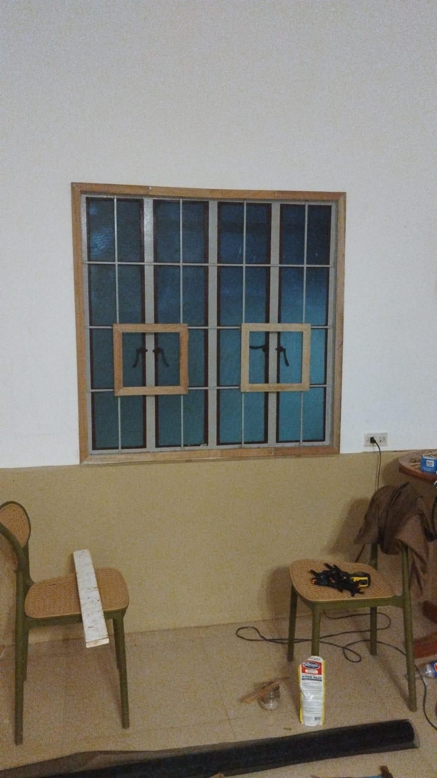 New wooden window frames being fitted during the renovation