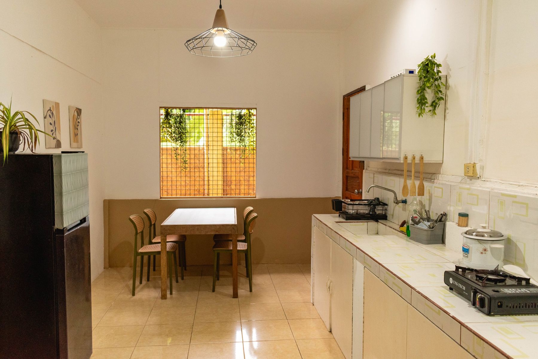Kitchen after the renovation with dining table and clean counters