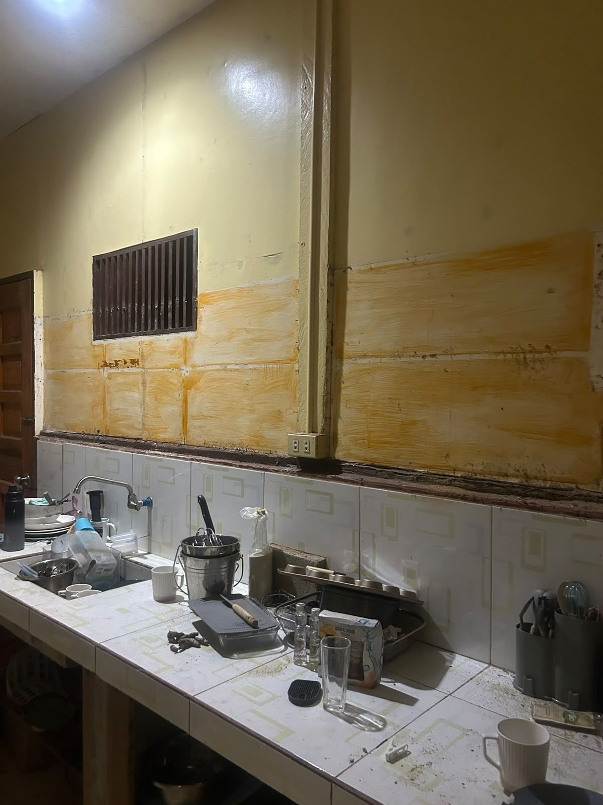 Kitchen before the renovation, stained walls