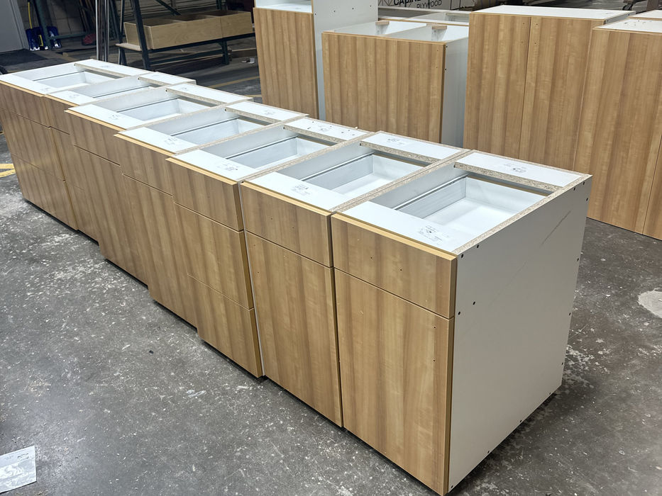 Long wood and white cabinet unit in workshop
