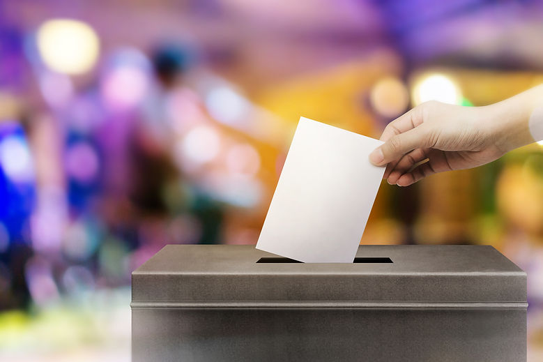 Colorful fo election vote, hand holding ballot paper for election vote concept at colorful