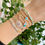 Miniaturbild: Atemberaubendes weißes Armband mit bösem Blick, vergoldetes Edelstahl-Schmuckset