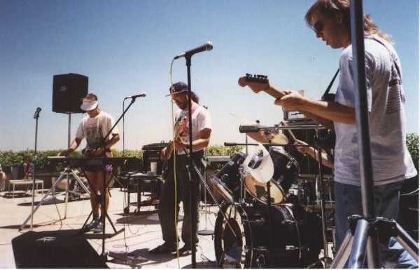 a picture of the Severe Tire Damage band performing during a live stream