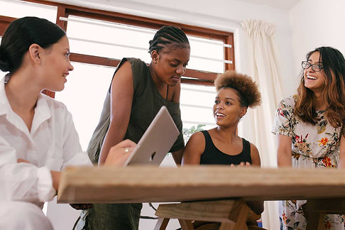 A diverse group of women in a corporate coaching session