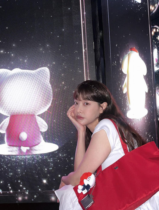 Woman with Hello Kitty display