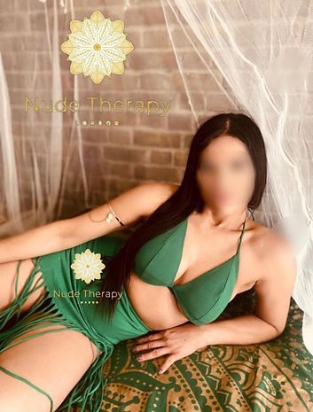 Heart Masseuse with sheer silk fabric in background