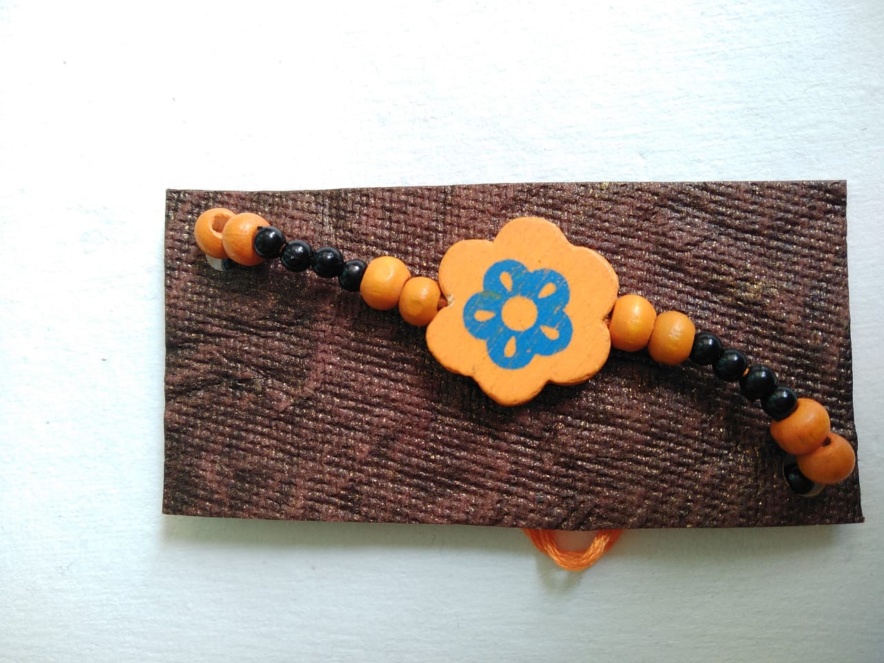 Orange flower Rakhi