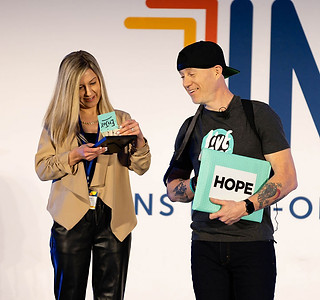 Jason Tharp Keynote Speaker Holding Hope Envelope