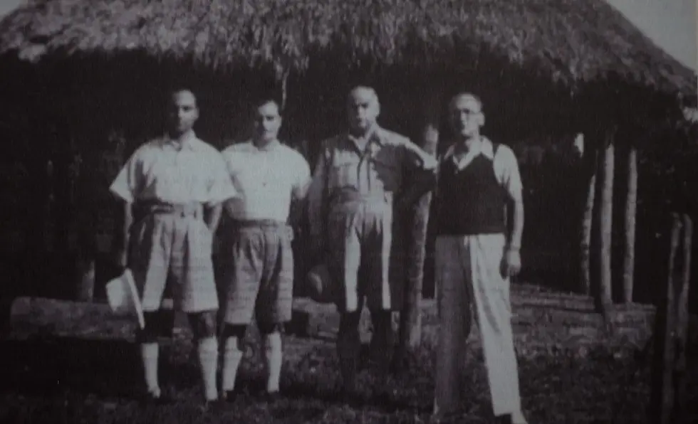 Three of the Maltese internees, Formosa, Ganado and Cossai, together with Enrico Mizzi in front of the internment camp at Uganda