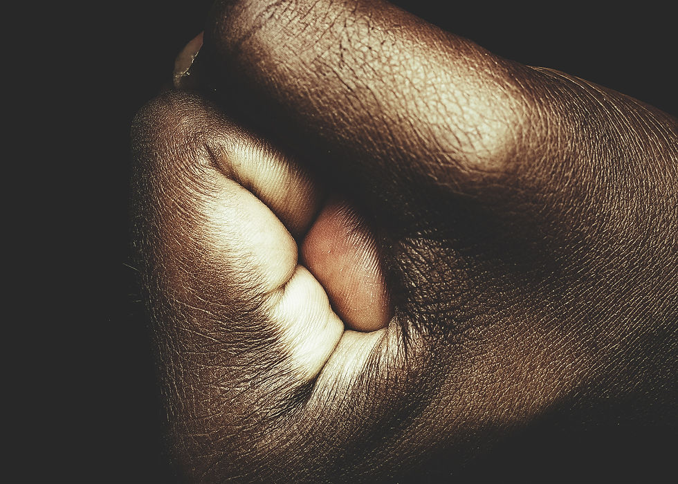 Dark skin man making a tight fist