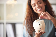Girl using a piggy bank