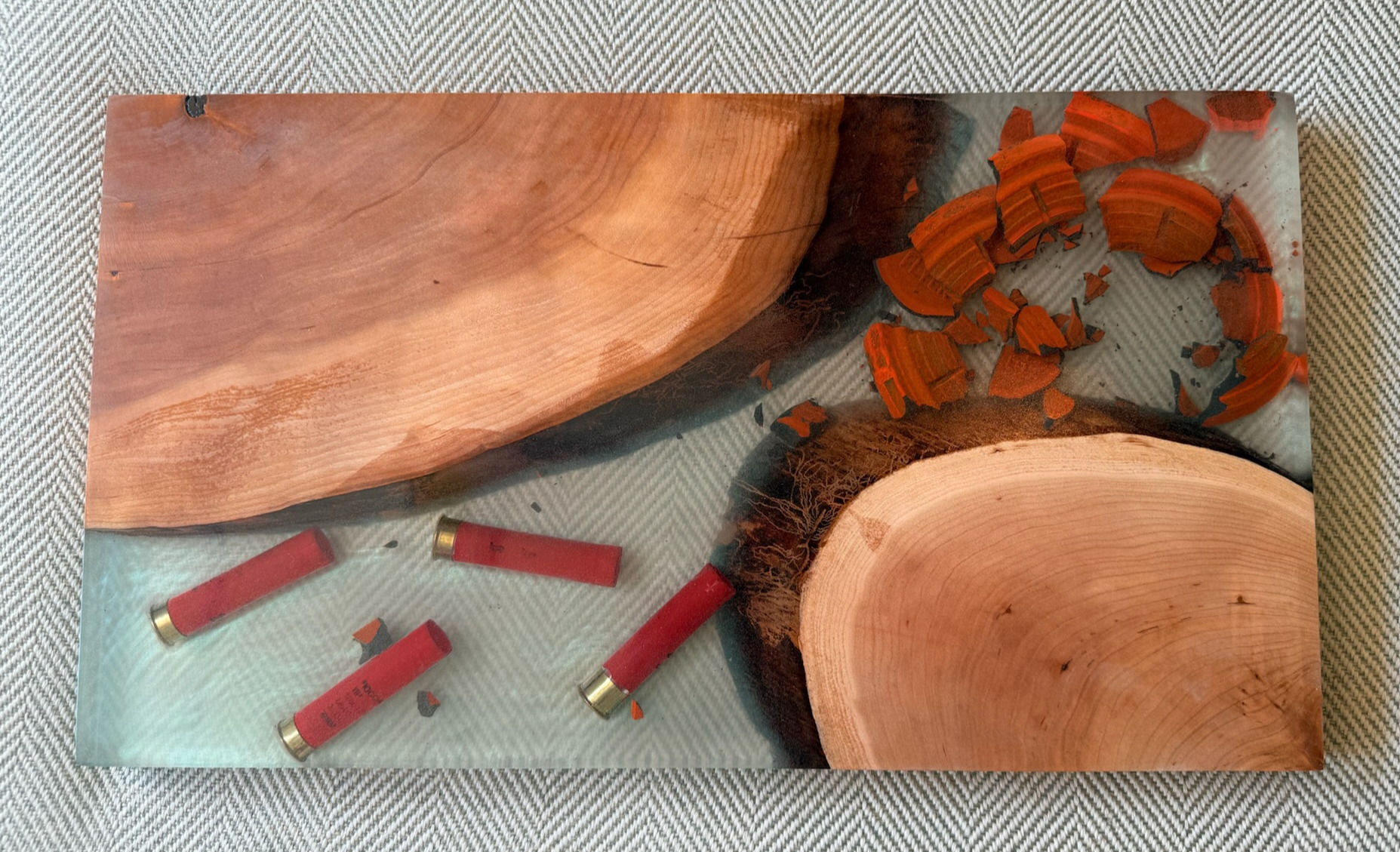 Shotshell with broken clay in Epoxy 18" x 10" x 1.1"