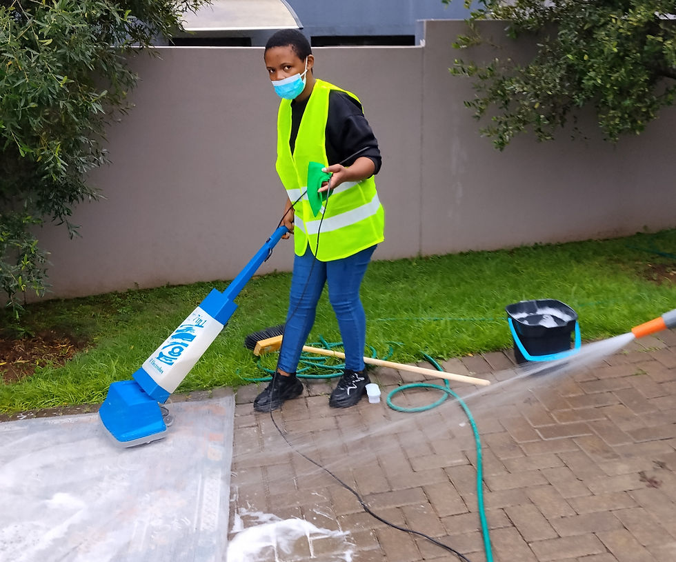 Shanela Cleaning Services: Woman scrubbing outdoor pavement