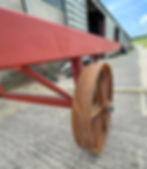 Wheel fitting in progress during the build of a handcrafted shepherd’s hut