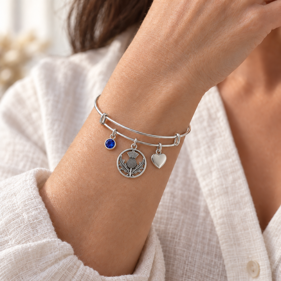 Scottish Thistle & Heart Bangle worn on a model’s wrist