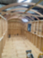 The making of a shepherd’s hut showing timber frame and curved roof