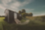 Handcrafted shepherd’s hut with corrugated cladding and traditional wheels by Tiny Homes