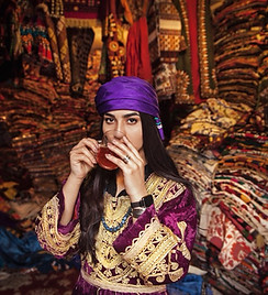 “Pearl In The Oyster” photo series by Fatimah Hosseini featuring Mahal Wak, in Kabul’s chicken street, drinking Afghan tea.