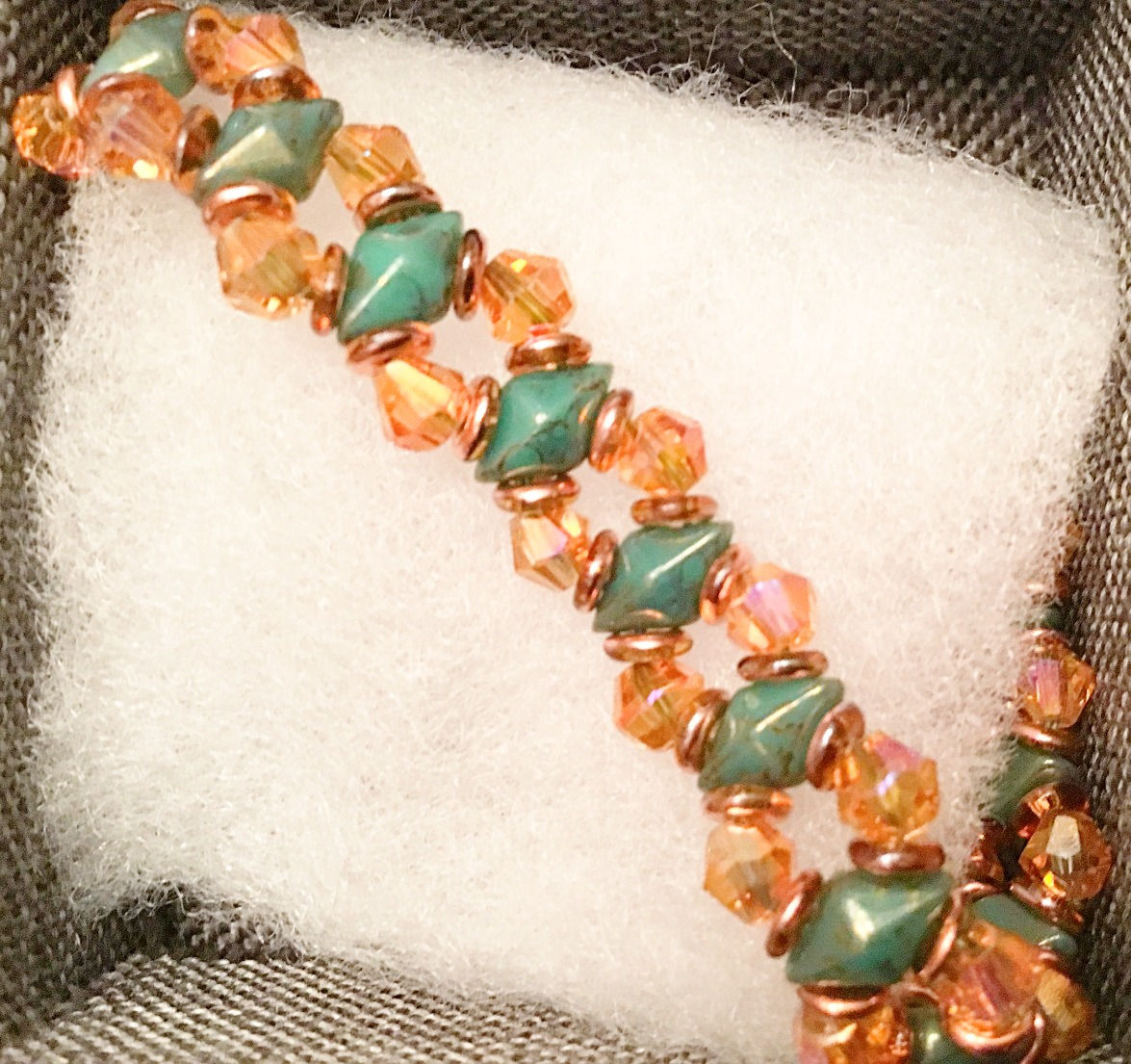 Beaded bracelet with amber color crystals