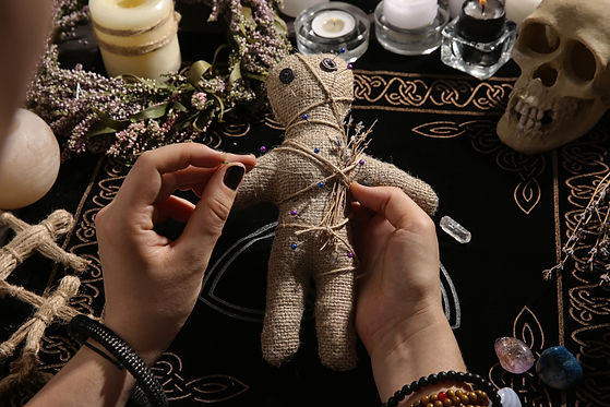 burlap-doll-pinned-by-hands-on-dark-fabric-2026-03-27-01-46-22-utc.jpg