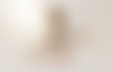 Melody Prochet sitting with guitar