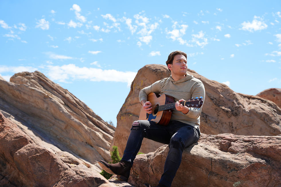 Presley Aronson Playing his Guitar
