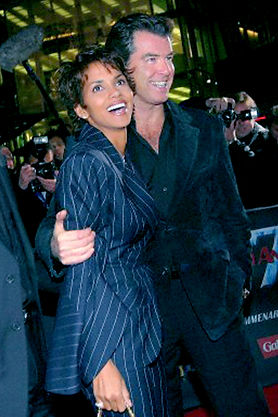 Halle Berry shown wearing Lloyd Klein to attend a moveie premier and she is accompanied by actor Pierce Brosnan