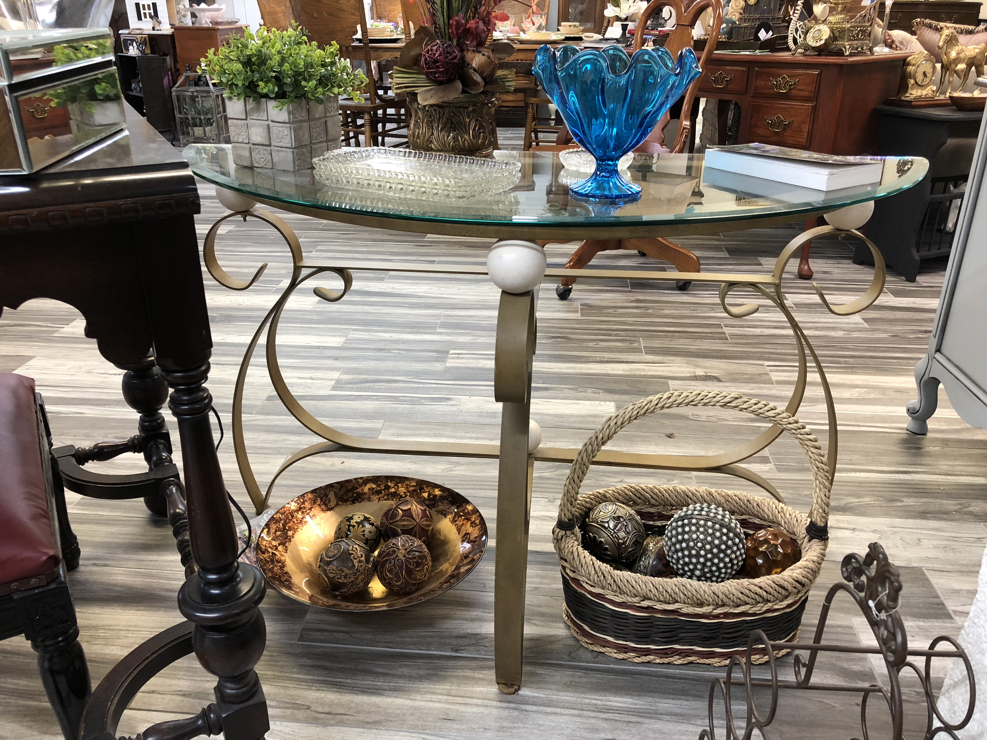half moon glass and metal table