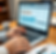 the hands of an accountant working on accounting software_edited.png